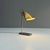 Table lamp called "Compass Dans L'Oeil" by Andreé Putman for Baldinger & Sons with a perforated metal shade. Sold through...