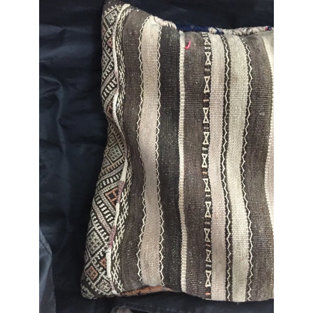 Rustic two sided Kilim pillow cover. Wool and cotton blend with multicolor stripes on one side and geometric earth tones...