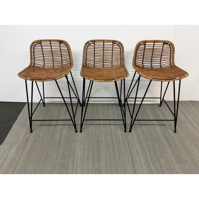 Design Plus Gallery presents a Set of Three Hermosa Counter Stools from Palecek. These bars stools have a black aluminum...