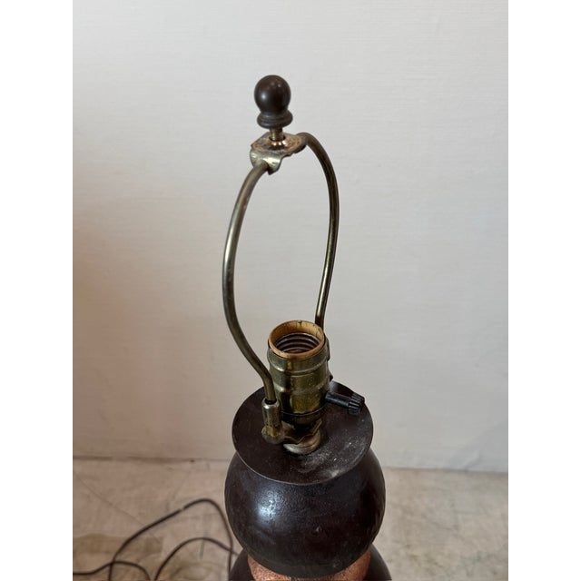 Elevate your space with this striking pair of vintage metal table lamps, featuring a sophisticated stacked sphere design....