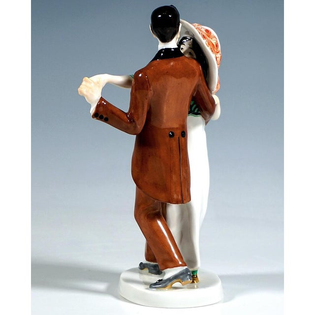 Very rare meissen art nouveau porcelain group: a dancing couple in elegant casual wear: the lady in a long, fitted dress...