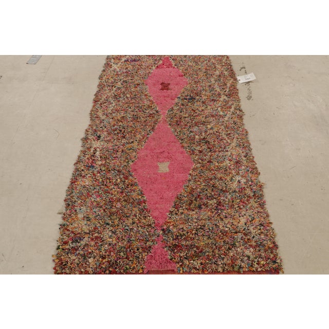 Originating from Morocco in 1950, this vintage midcentury Moroccan Berber rug has a combination of both distinct and...