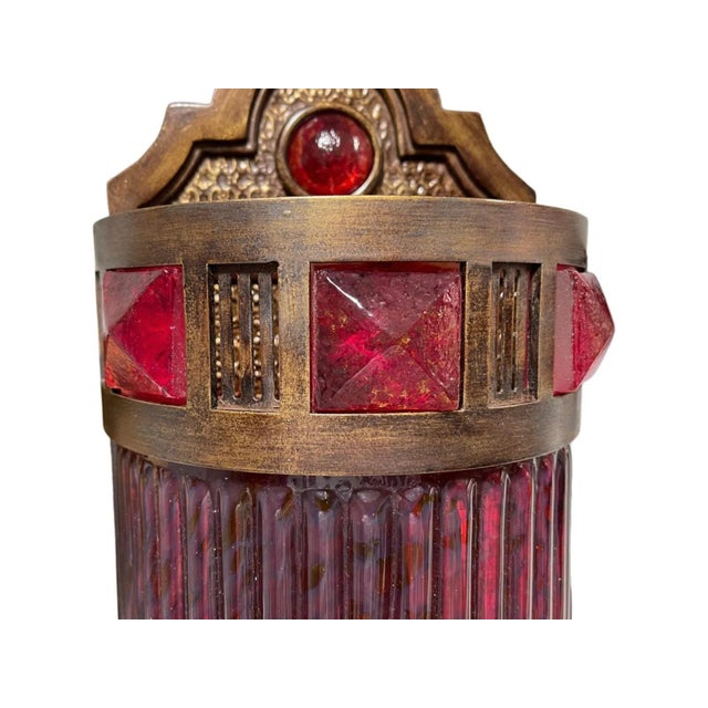 An elegant wall sconce from the Scheherazade collection by Fine Art Lamps, showcasing meticulously crafted metalwork...