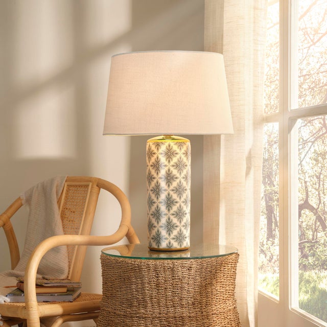 The repeating pattern on these colorful lamps is hand stamped by expert artisans onto a cream ceramic base. Additional...