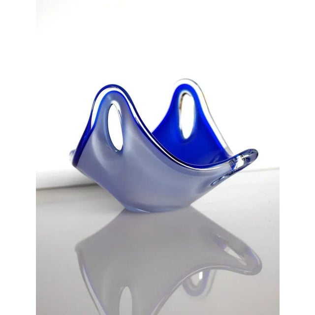 An incredible hand-blown vintage glass bowl, made and signed by the talented Paul Kedelv for Flygsfors, Sweden. The piece...