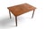 This draw-leaf dining table was crafted in Denmark during the 1960s. The solid teak top extends via a draw-leaf mechanism...