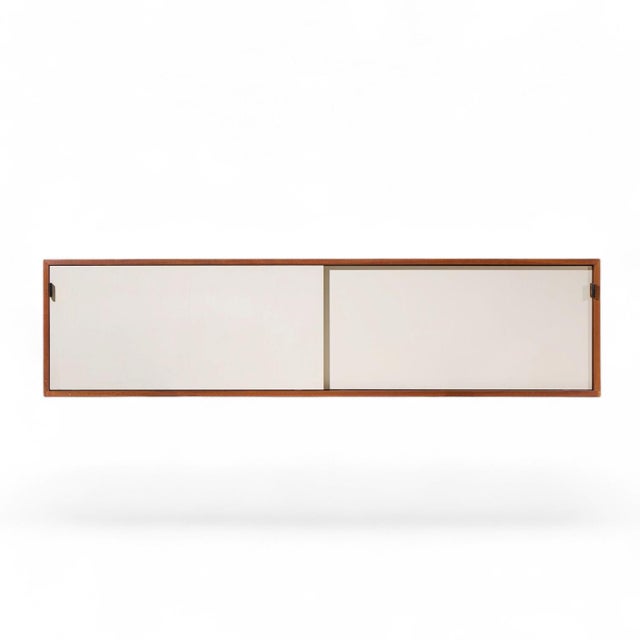 Florence Knoll 123 W-1 Mid Century Walnut Wall Mount Credenza This credenza measures: 72 wide x 15.25 deep x 17.75 inches...