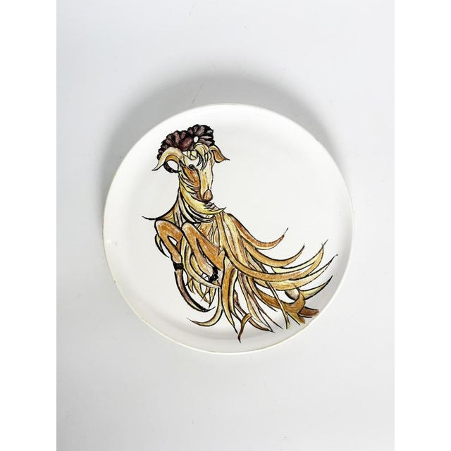 Glazed ceramic decorative plate featuring an original illustration of a ram's head, rendered in a contemporary and...