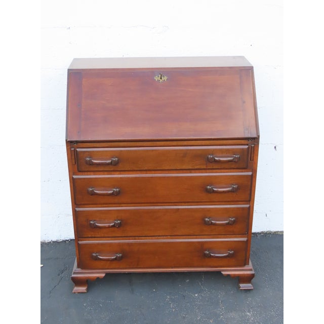 This Secretary Desk is made out of wood, solid wood, and veneer. This Secretary Desk has an Art Deco Traditional style...