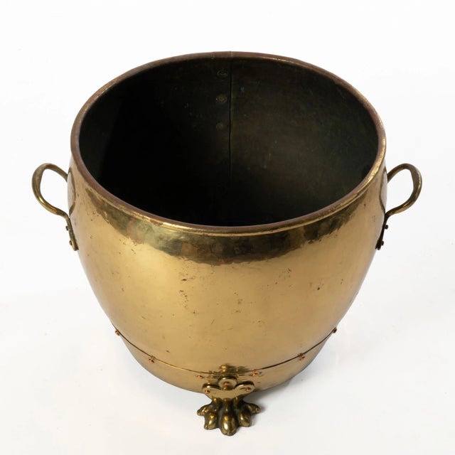 A gorgeous English brass jardiniere with copper rivet. Great as a decorative pot or planter and can be used to store...