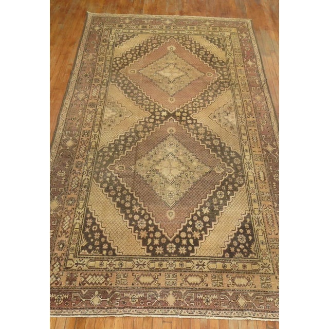 An early 20th Century gallery size Khotan rug. This piece is a true antique, one-of-a-kind rug that has been...