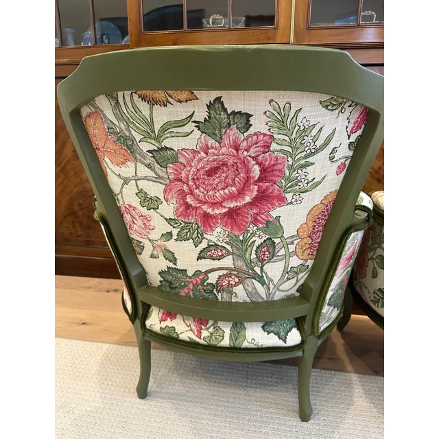 An exceptional pair of vintage French Bergère lounge chairs, thoughtfully reimagined with a sophisticated blend of...