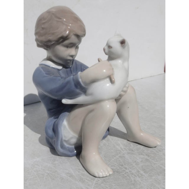 Royal Copenhagen porcelain Girl and Cat. designed by artist John Galster. Marked dating 1969-1975. Hallmarked Royal...