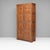 Two door oak cupboard with fielded panelling edged with plated beading. Retractable hanging rails. France circa 1940.