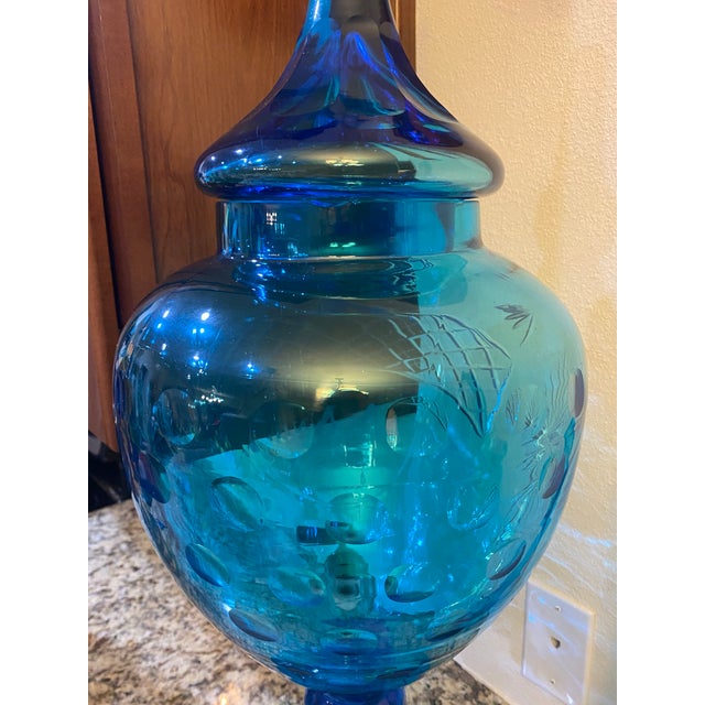 Stunning late 19th century, circa 1880 blue cut glass footed Brandy decanter with simple brass spigot and finial lid. The...