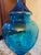 Stunning late 19th century, circa 1880 blue cut glass footed Brandy decanter with simple brass spigot and finial lid. The...