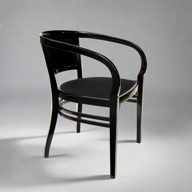 A Vienna Secession period armchair from Austria circa 1910. Designed by Josef Hoffmann and executed in black lacquered...