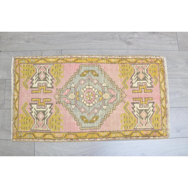 This is a vintage Turkish Oushak rug from the 1960s. The piece was hand-knotted.
