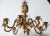 Solid brass pineapple chandelier. Eight lights. Includes original canopy and chain. New old stock.