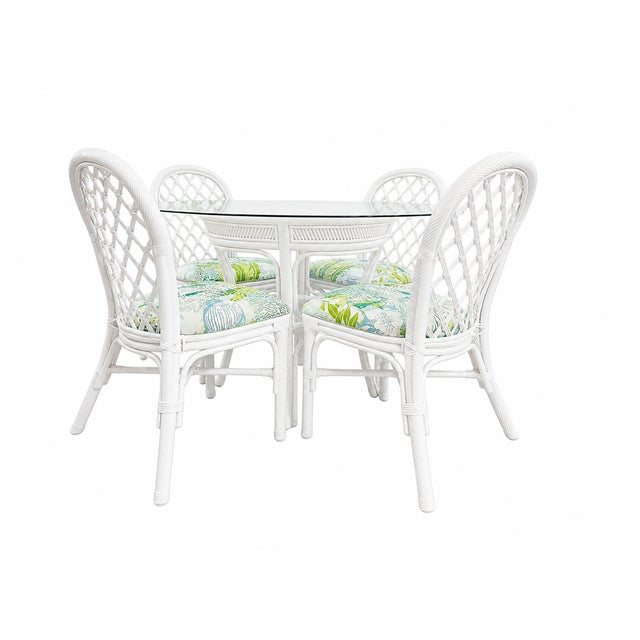 Elevate your space with this beautifully refreshed rattan dining set. Freshly lacquered in Benjamin Moore’s Super white,...