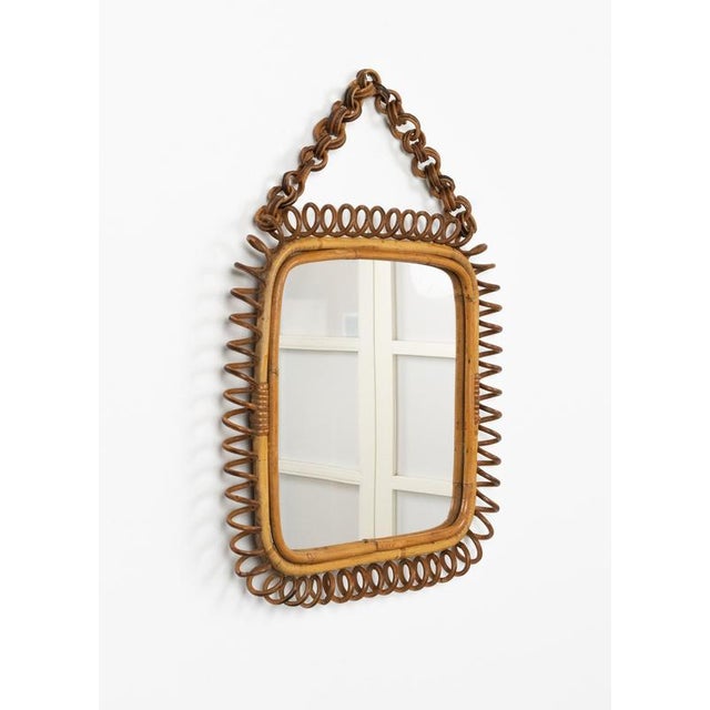 Midcentury beautiful squared wall mirror with chain in bamboo and rattan in the style of Italian design Franco Albini....
