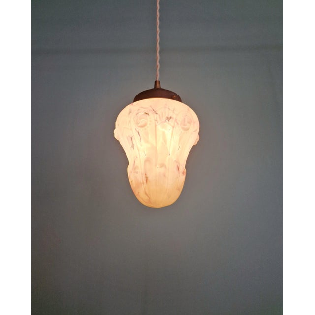 Art Deco pendant light in speckled white and purple molded pressed glass, with a copper-plated metal frame, circa 1920....