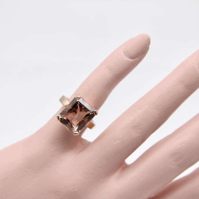 The golden hues of this 14k rose gold ring make a perfect complement to the peachy tones of the Morganite stone set within...