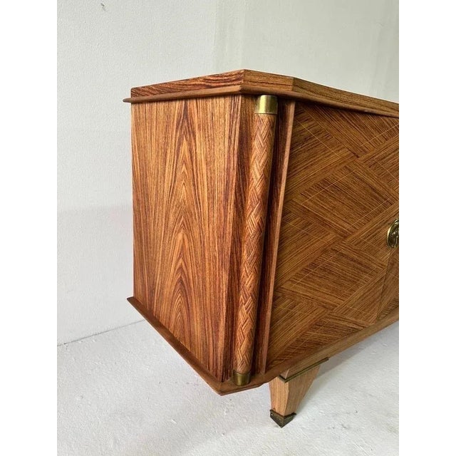 French Art Deco buffet, sideboard or credenza attributed to Jules Leleu. Constructed with superior quality blond woods,...