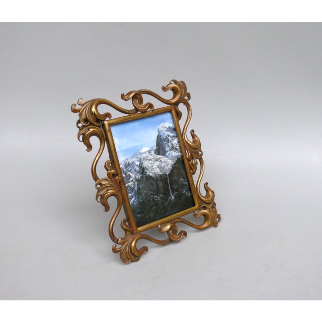 An impressive floral picture frame with intertwined leaf tendrils, made in Germany during the Art Nouveau period. This...