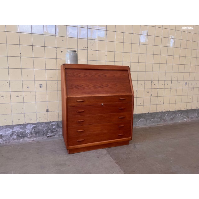 This secretary, designed by Dyrlund in Denmark, is a refined example of thoughtful and functional design. It features a...