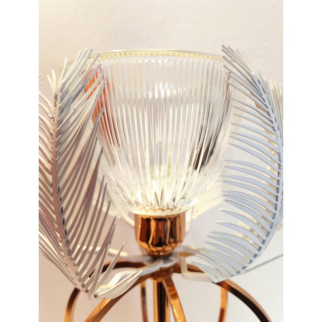 Gallo table lamp, made in Italy in the early 2000s and now out of production. It features a metal base with a polished...