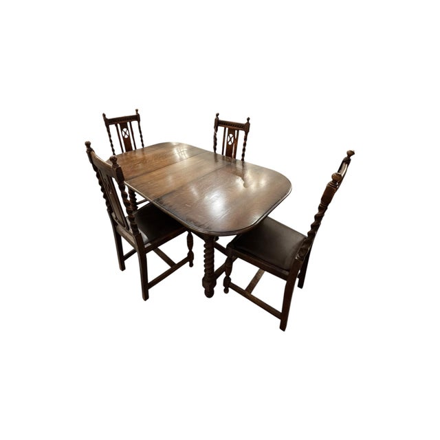 Description: Vintage English style dining set featuring beautifully turned barley twist legs, carved chair backs, and a...