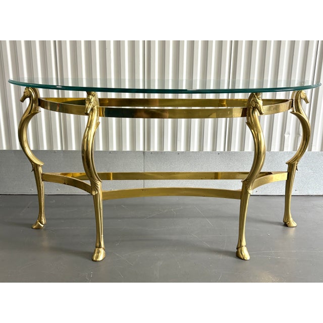 Vintage solid brass sea horse console table/ entry way table. Very unique piece to add to your home. The table comes with...
