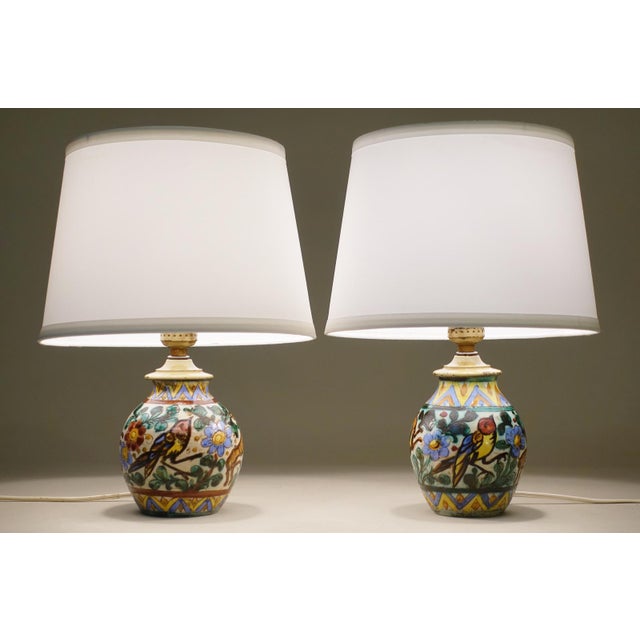 A simple yet enchanting pair of Mojolica hand painted brilliant graphic design glazed ceramic table lamp designs produced...