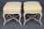 A charming and beautifully proportioned pair of French Louis XV-style upholstered stools, dating to the 1950s or 1960s....