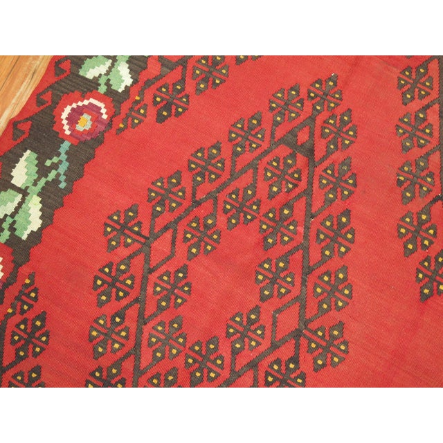 Affordably priced hand-made r intermediate size Besserabian Kilim with floral elements throughout. 6'10'' x 10'7''