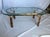 Beautiful oval shaped Faux Bamboo/ Gold Leaf Coffee Table. from the Hollywood Regency period. Pretty gold leaf finish on...