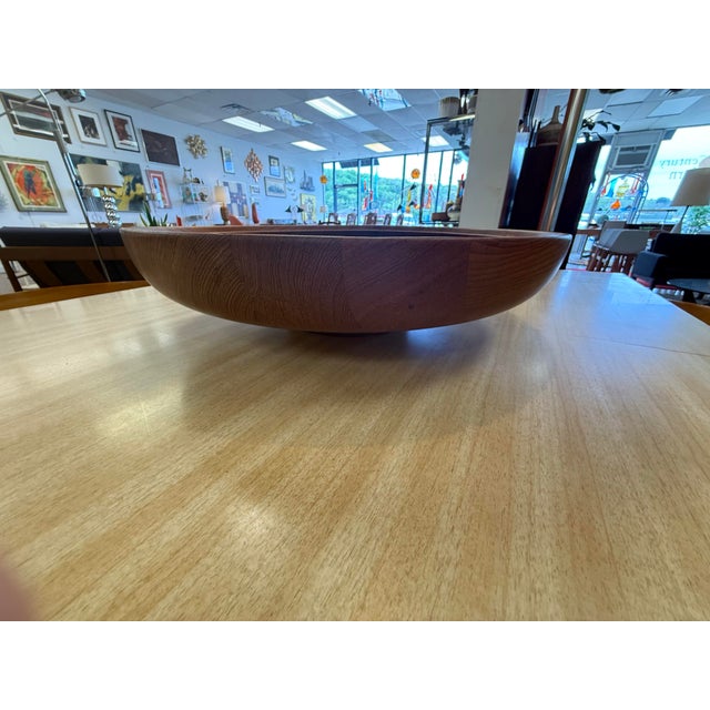 This is a rare large 19” diameter Henning Koppel designed turned teak bowl for Georg Jensen. This was produced in Denmark...