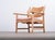 Danish lounge chair designed by Henning Kjærnulf and produced by Nyrup Møbelfabrik in the 1960s. Crafted in solid oak, the...