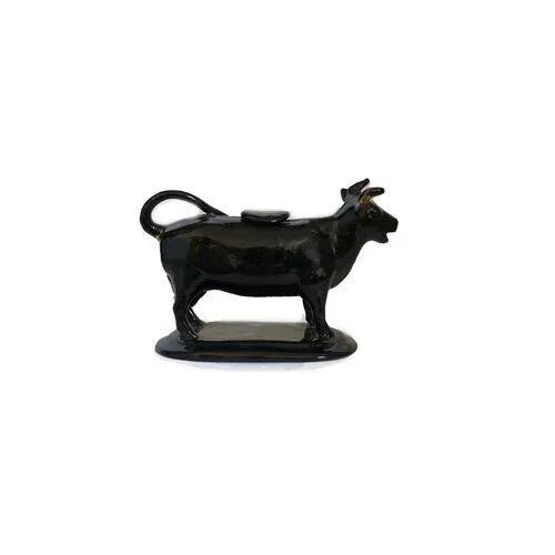 Antique Staffordshire Jackfield cow creamer. Cream goes in the back (original plug included) and pours out her mouth....