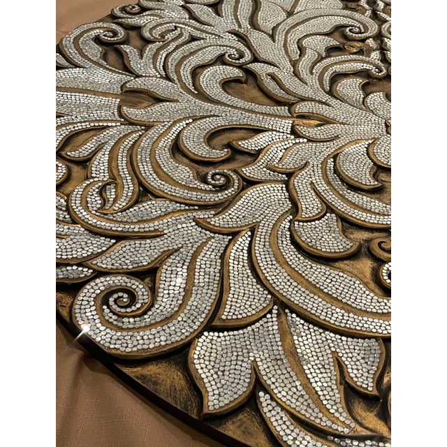 Add a striking statement of texture and glamour to your interior with this exceptional, oversized round wall medallion....