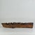 An unusually developed piece of branch of wood, which could have grown around a fence or cable or such. Or could this have...
