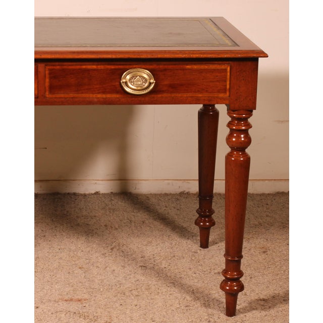 Elegant small mahogany desk from the 19th century in England. This beautiful desk features two drawers in the apron. The...