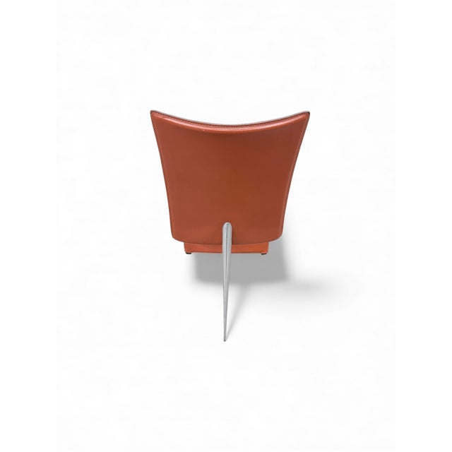 Ed Archer model, in red leather. The basic structure comprises the backrest, seat, and front support, creating a clean,...