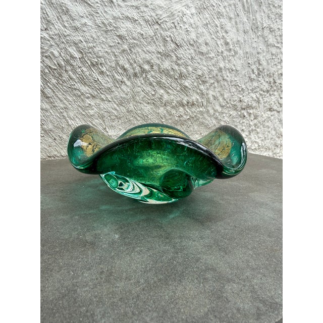 Hand blown brilliant emerald green glass with gold flecks bowl possibly made in Murano, Italy. The bowl is not marked.