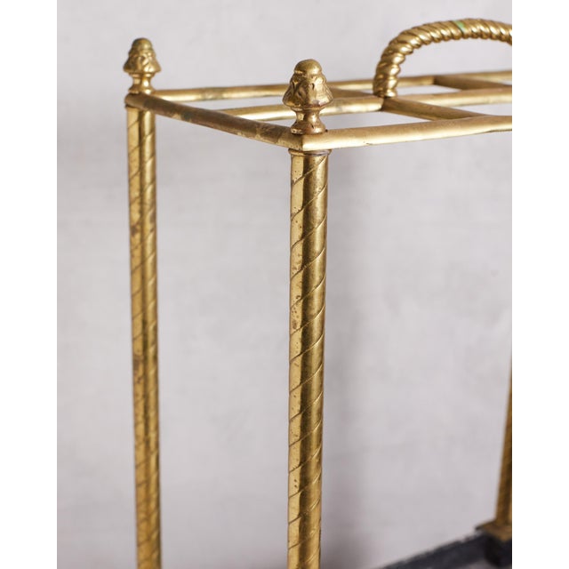 Stunning turn of the century Edwardian umbrella and cane stand. The frame is lacquered brass with some underlying...