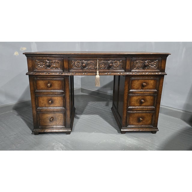 Super quality jacobean oak nine drawer pedestal desk, with brown leather top, in excellent overall condition, does not...