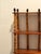 Sensational very tall elongated bamboo and wood etagere bookcase having a warm tortoise patina and black iron finials and...