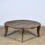This small coffee table dates from circa 1920 and is made of solid pine. The round top consists of wide, weathered planks...