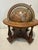 This vintage world desk globe, measuring 11 inches in height with about 10-inch diameter, is adorned with intricate...